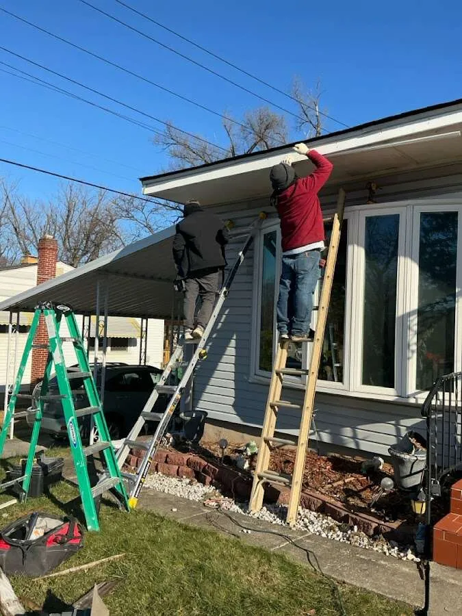 Restoration crew performing exterior repair in Macomb